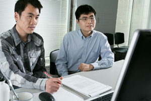 Dr. Lian Duan (right), assistant professor of mechanical and aerospace engineering, works with Chao Zhang, a Ph.D. candidate in aerospace engineering.