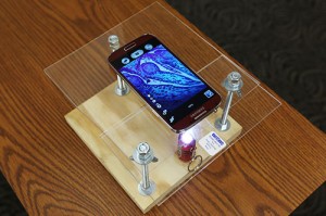 Daniel Miller, a recent biological sciences M.S. graduate, built this do-it-yourself microscope with a smartphone and less than $10 in materials. (Photo by Sam O'Keefe.)