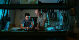 Dr. Westenberg working with a student in a laboratory. 