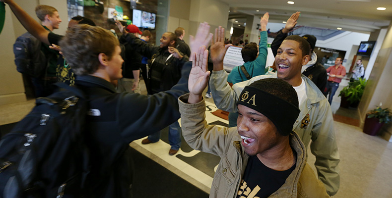 Members of the Epsilon Psi chapter of Alpha Phi Alpha high five fellow S&T students as they enter the Havener Center every Friday during session. It's an Alpha Phi Alpha tradition known as "Happy Phriday."