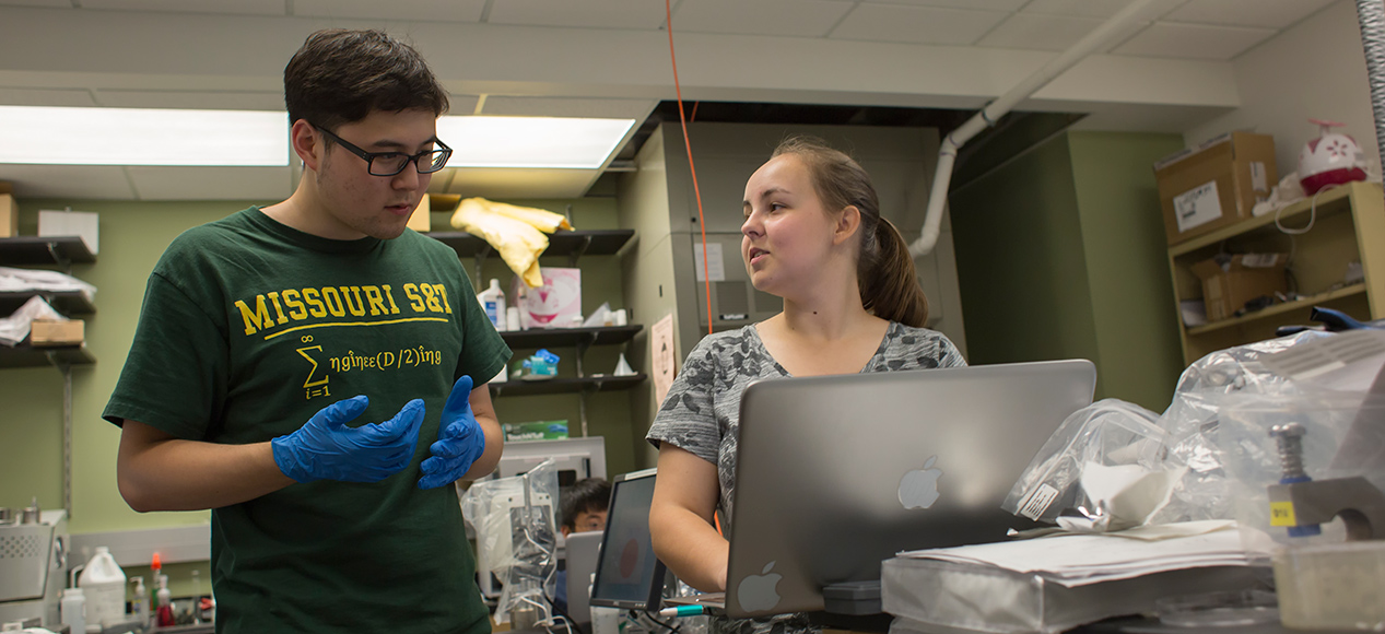 Dr. Jonghyun Park oversees high school students Daniel Yoon and Jessica Slavick during the Summer Research Academy. The project focuses on energy storage as Daniel creates a lithium ion battery. Photo by Sam O'Keefe/Missouri S&T