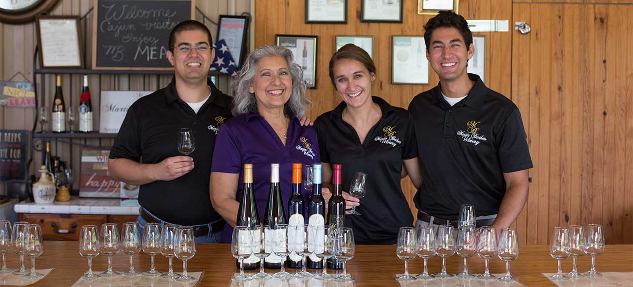 Patrick Martin (from left), Esther Martin, Anna Wallace and Derek Martin pose with Martin Brothers Winery's mead offerings at the winery's guided tasting bar outside of Hermann, Missouri.