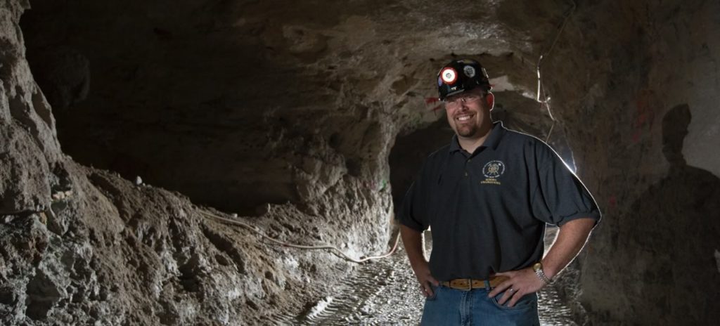 Braden Lusk stands at the entrance of the Missouri S&T Experimental Mine, photo by Sam O'Keefe