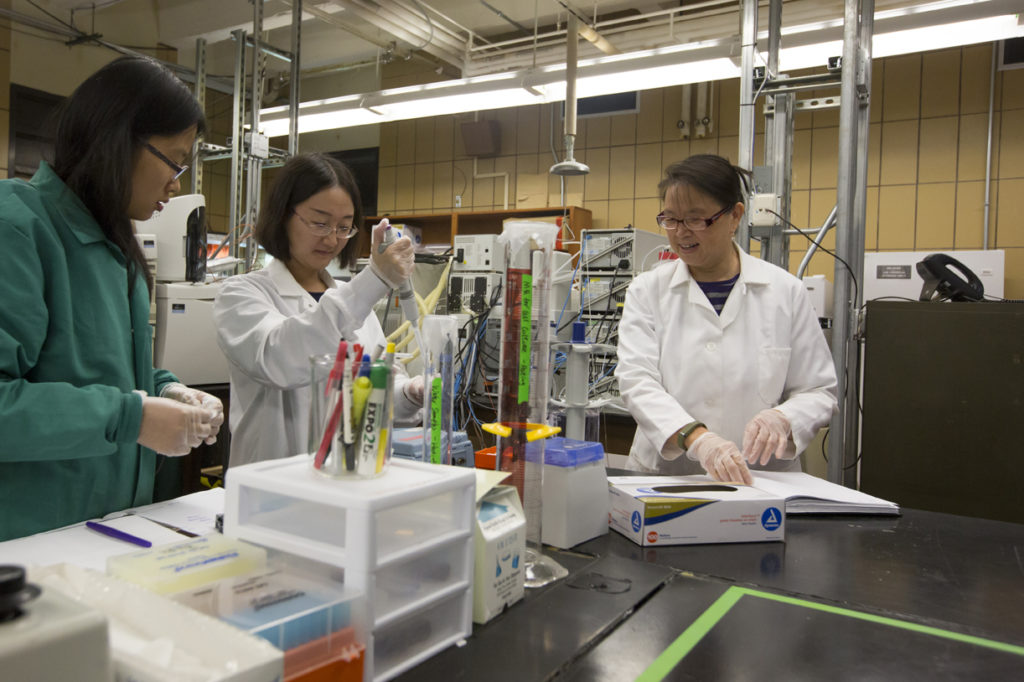 Dr. Honglan Shi and her students Runmiao Xue and Haiting Zhang conduct drinking water quality research in Schrenk Hall.