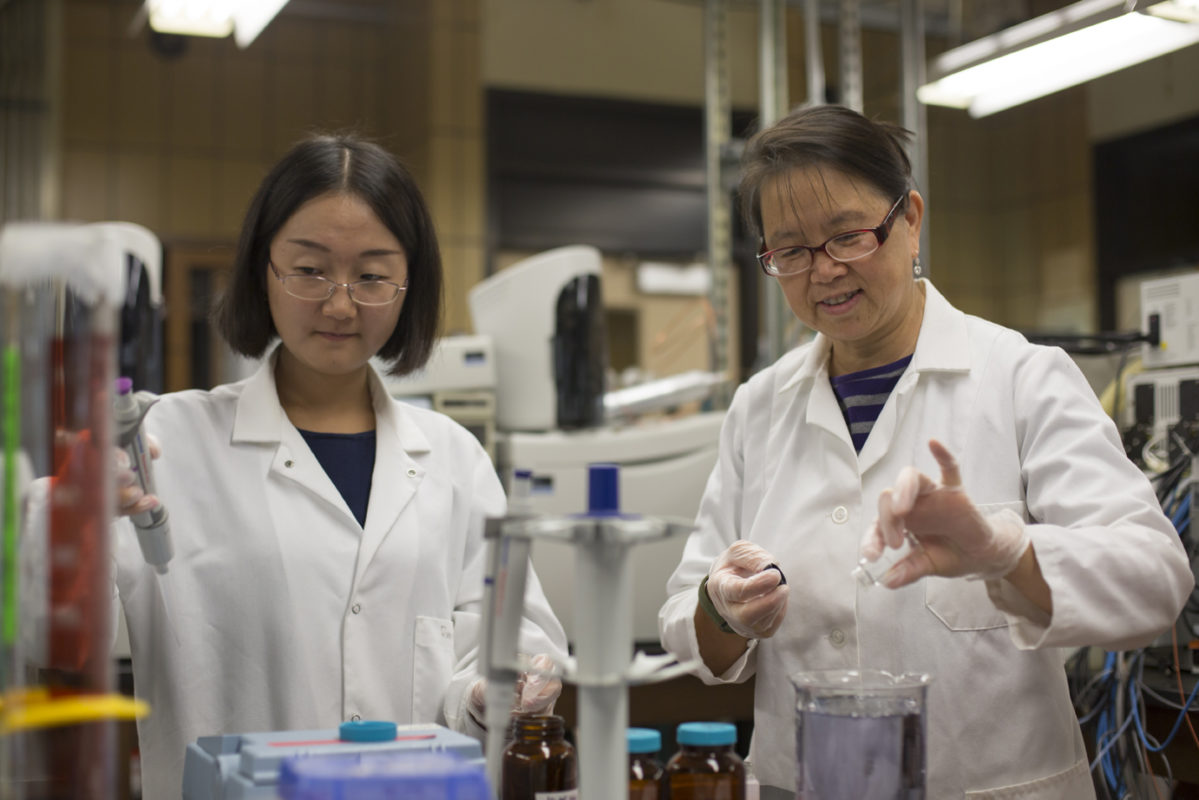 Dr. Honglan Shi and her students Runmiao Xue and Haiting Zhang conduct drinking water quality research in Schrenk Hall.