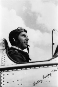 Lt. George Allison Whiteman poses in the cockpit of his plane, the "Lucky, Lucky Me!"