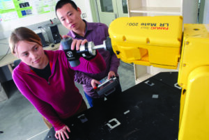Jennifer Creamer and Le Ma, both Ph.D. students in mechanical engineering, work in Precision Motion Control Laboratory. Creamer's research on improving the accuracy of machining and milling operations was recently published.
