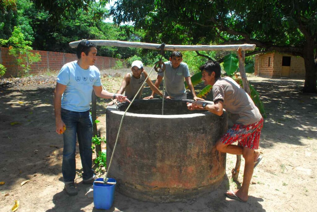 S&T students and faculty work with locals on a water well in Guatemala.
