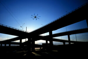 Photo of unmanned aerial vehicle above bridge.