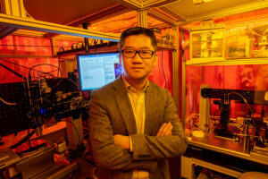 NSF CAREER Award recipient Dr. Heng Pan, assistant professor of mechanical and aerospace engineering, by his nanomanufacturing equipment. Photo by Tom Wagner/Missouri S&T.