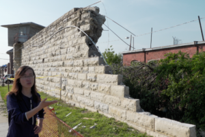 Dr. Guirong (Grace) Yan inspects the wall of the former Missouri State Penitentiary, which was damaged by the tornado that struck Jefferson City, Missouri, on May 22, 2019. Photo by Terry Barner/Missouri S&T.
