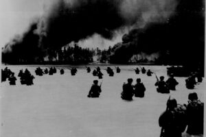 The U.S. Army's 165th Infantry Regiment, 27th Infantry Division, invading Butaritari, the main island of the Makin Atoll in November 1943. National Archives photo.