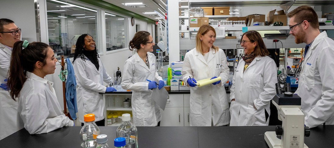 Dr. Nuran Ercal, Professor of Chemistry, with students and researchers at Shrenk Hall, Photo Tom Wagner