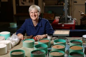 Dr. Leslie Gertsch with meteorite samples in her lab