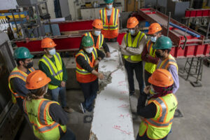 Dr. ElGawady and students investigating damaged concrete girder