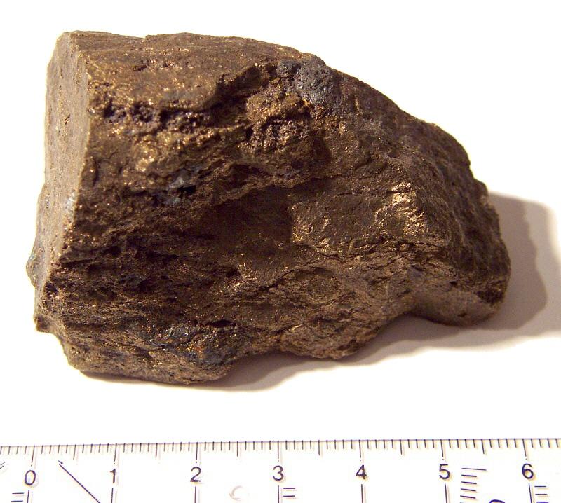 Photo of renierite, a brown rock with gold highlights and a source of germanium