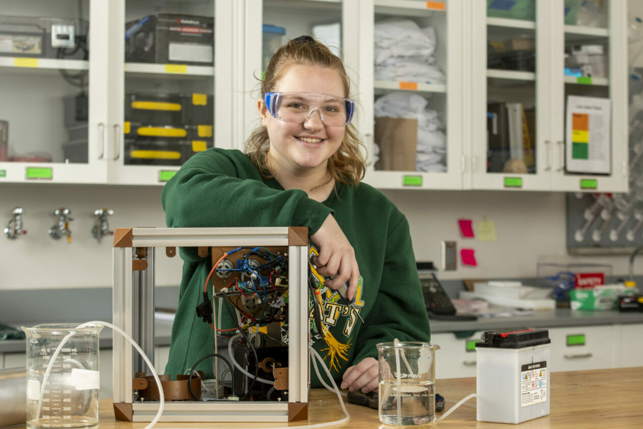 Photo of Anna Baldus in lab with Chem-E Cube