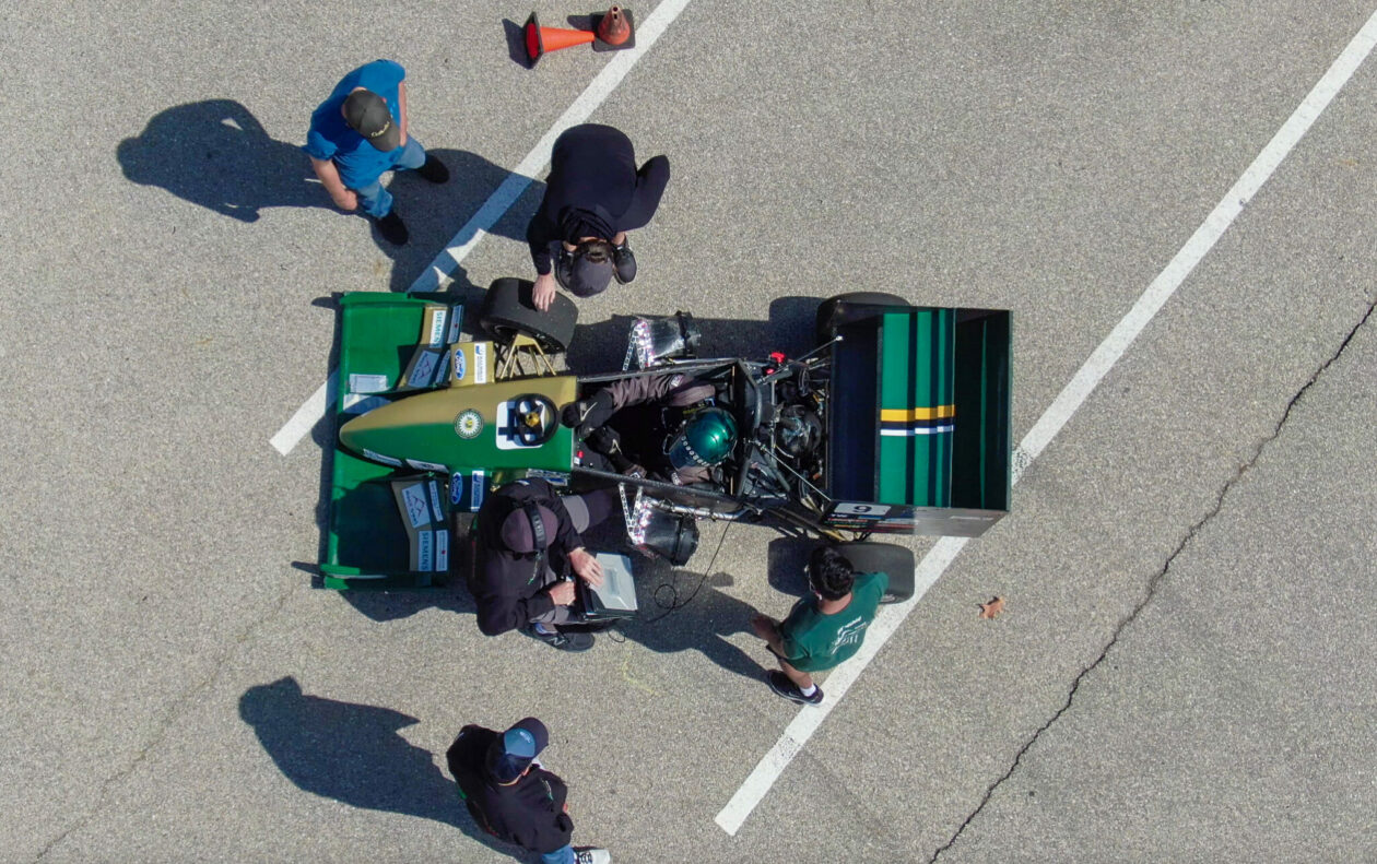 The Formula SAE Design Team is one of 19 student design teams at Missouri S&T. Here, the team gives the formula-style racer an inspection during a pit stop.
