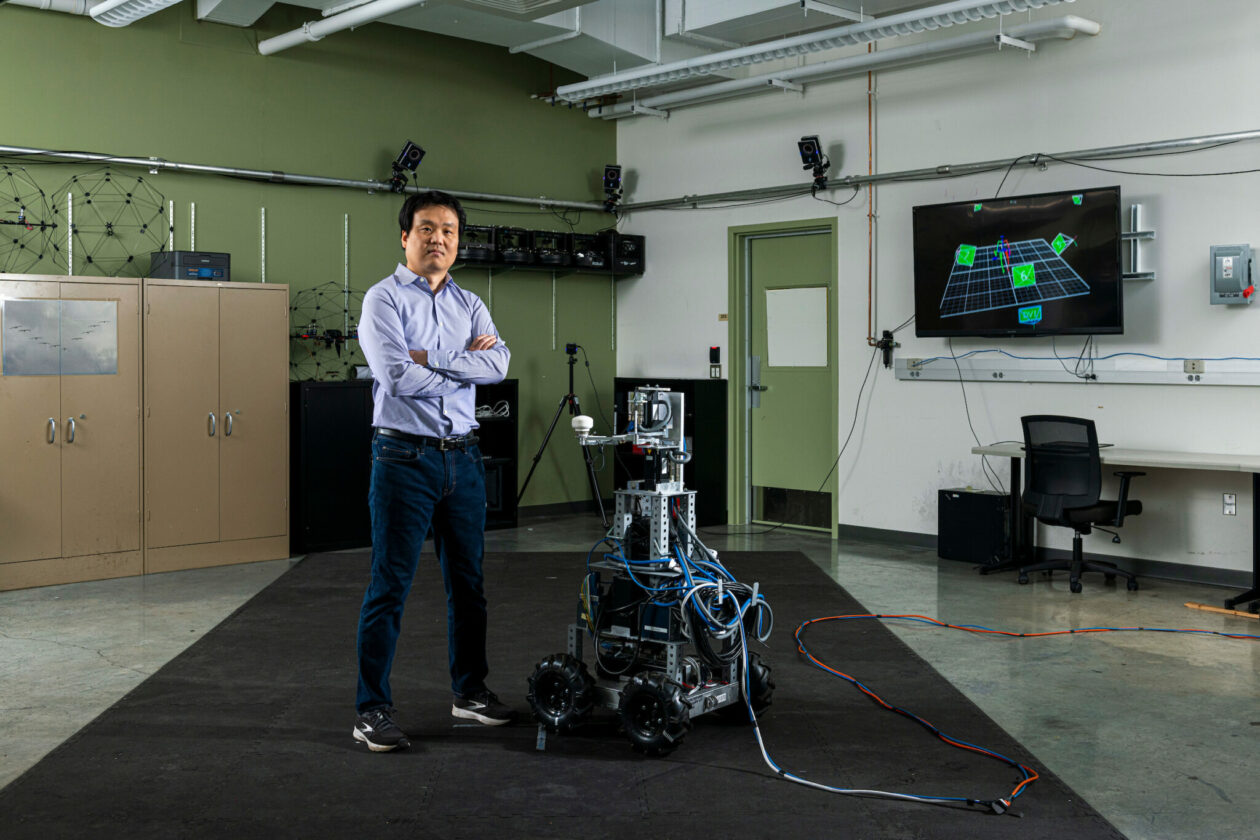 Dr. Yun Seong Song, assistant professor of mechanical and aerospace engineering at Missouri S&T, with his interactive robot Ophrie