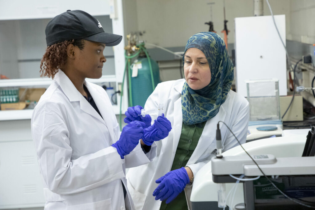 Dr. Lana Alagha and Ph.D. student Catherine Monyake in lab