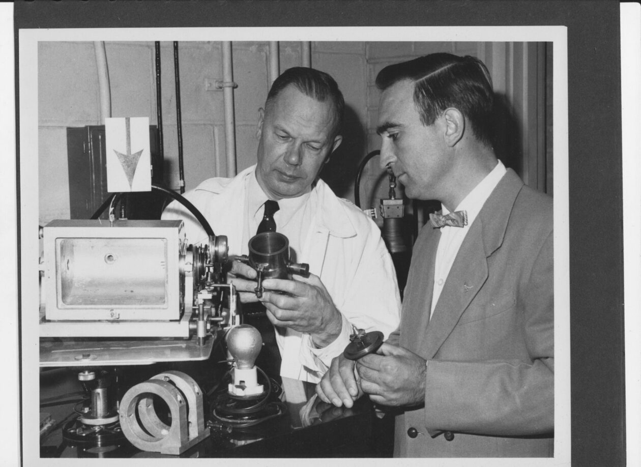 Dr. Martin E. Straumanis (left) with colleague Dr. William James examining an X-ray microscope. Photo courtesy of S&T Archives.