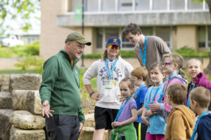 Joel Burken with a group of young students.