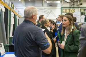 Career fair participants. Student and recruiter.