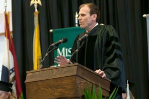 Gary White speaking at a Missouri S&T commencement ceremony.