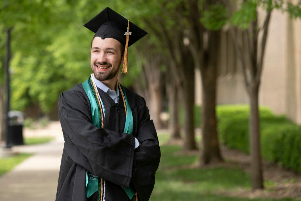 Nolan Hall in cap and gown on S&T's campus.