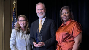 Dr. Daniel Oerther, center, was recently presented with the ANA Champion of Nursing Award. He is pictured here with Dr. Jennifer Mensik Kennedy, left, president of ANA, and Dr. Khaliah Fisher-Grace, chair of the awards committee. Photo courtesy of Oerther.