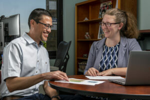 Dr. Casey Canfield works with Dr. Javier Valentin-Sívico, one of her former Ph.D. advisees who is now an S&T assistant teaching professor of engineering management and systems engineering. Photo by Michael Pierce/Missouri S&T.