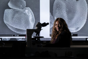 Dr. Francisca Oboh-Ikuenobe examines Batiacasphaera obohikuenobeae. Photo by Michael Pierce/Missouri S&T.