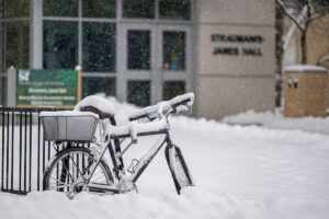 Bicycle covered in snow at bike rack outside Straumanis-James Hall on the S&T campus