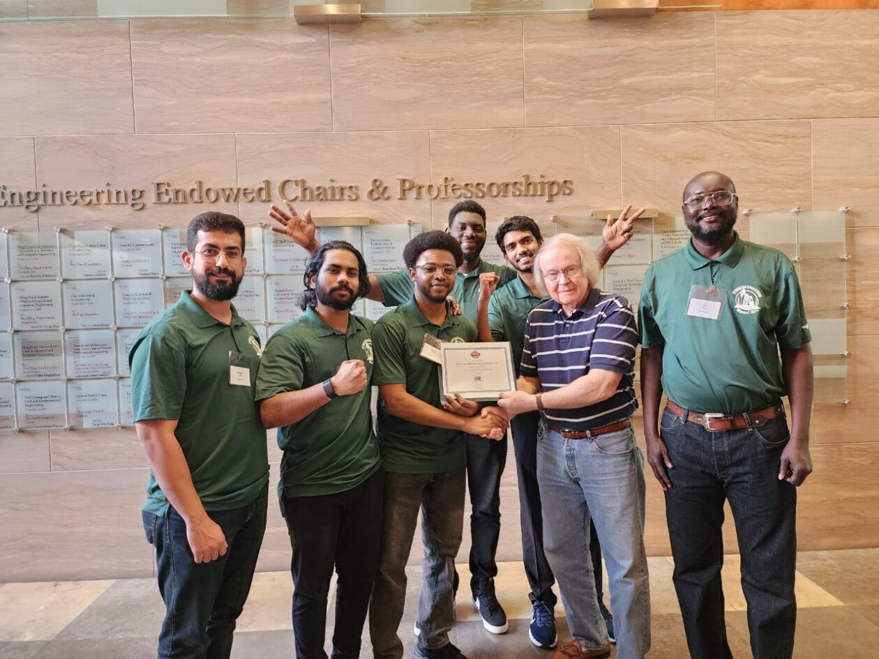 From left, S&T team members Ahmed Al-Hlaichi, Abhinav Medithi, Abdul Mujeeb, Sulaiman Bah and Nikhil Chodipilli standing with Buddy Woodruff, a senior PetroBowl judge, and Makuach James Makeny, the S&T team coach. Photo courtesy of Makuach.