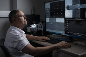 Dr. Joseph Newkirk operates a testing device in S&T’s Toomey Hall. Photo by Blaine Falkena/Missouri S&T.