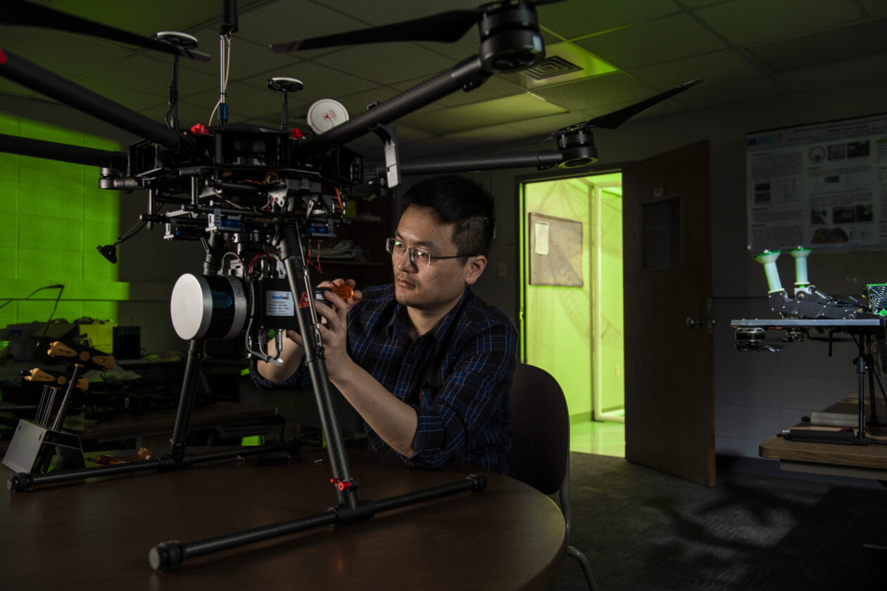 Dr. Xinzhe Yuan, a Missouri S&T alumnus, adjusts a drone in an S&T lab when he was a student in 2021. Photo by Michael Pierce/Missouri S&T.