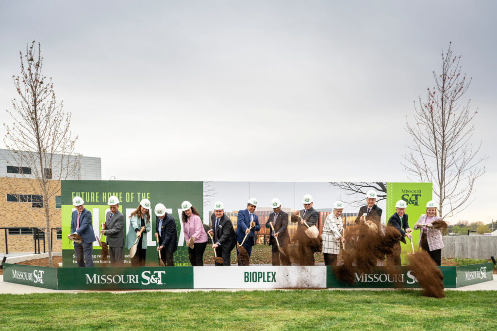 13 leaders shovel dirt during Bioplex groundbreaking ceremony on April 9