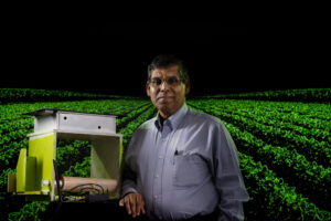Dr. Sajal Das poses with technology he developed to support agriculture operations. Photo by Michael Pierce/Missouri S&T.