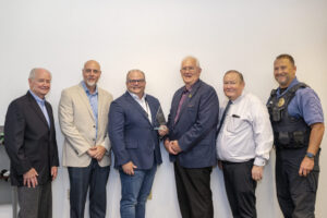 From left, Richard Bausell, academy member and 1970 S&T alumnus; Dr. David Borrok vice provost and dean of S&T’s College of Engineering and Computing; Ralph Grant, the awardee; Dr. Joseph Smith, professor in the Linda and Bipin Department of Chemical and Biochemical Engineering; Dr. Doug Ludlow, professor in the Linda and Bipin Department of Chemical and Biochemical Engineering and Doug Roberts, chief of University Police. Photo by Michael Pierce/MissouriS&T