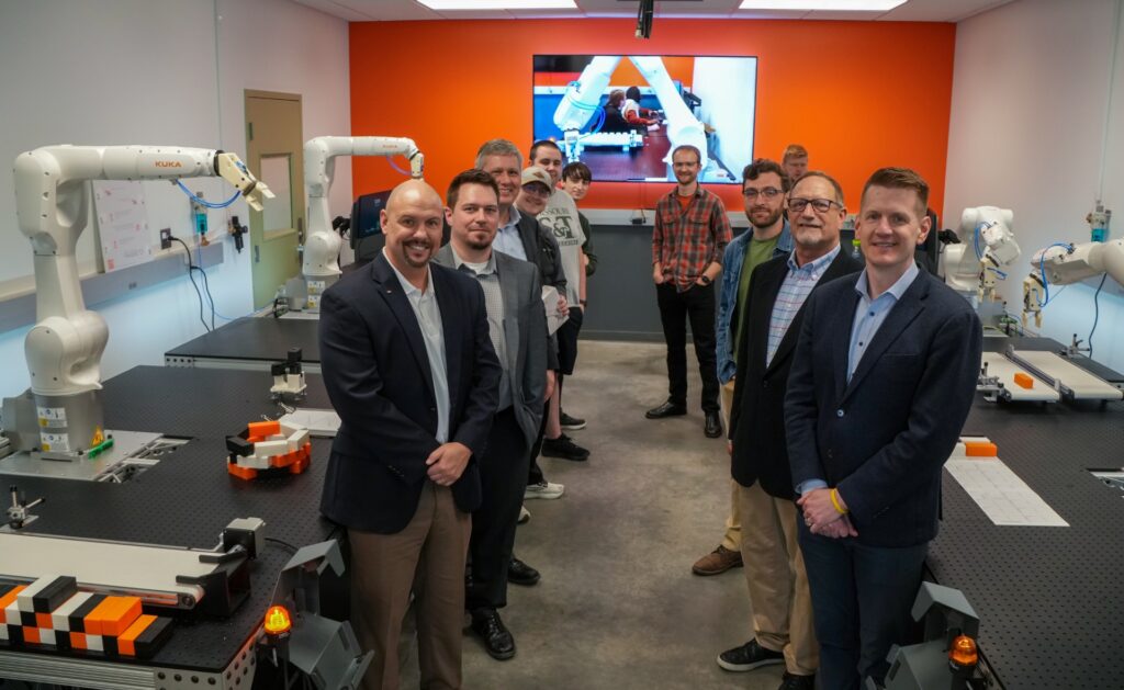 Pennuto, front right, stands in the lab with other stakeholders who attended the event. Photo by Terry Barner/Missouri S&T.