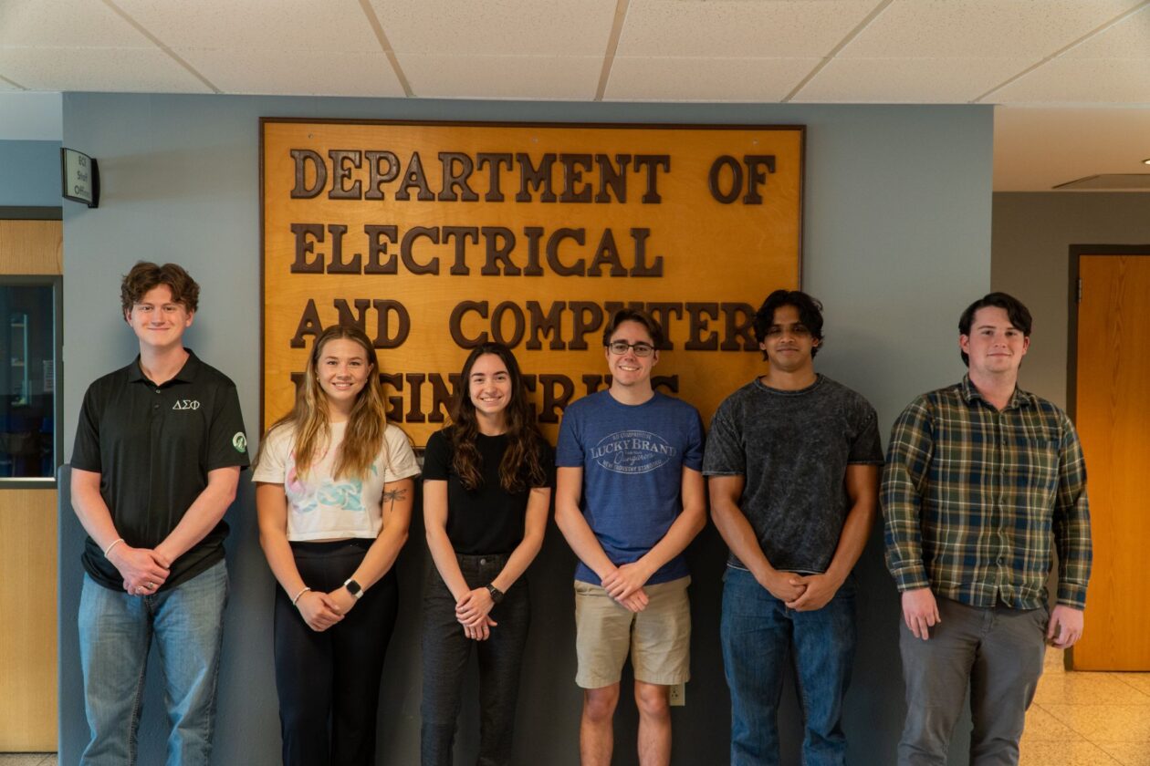 Six students in front of ECE sign