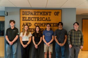 Six students in front of ECE sign
