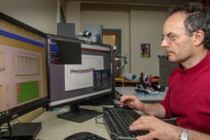 Dr. Marco Cavaglia looking at computer.