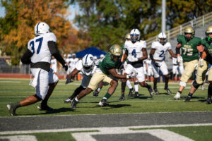 Football players on the field during Missouri S&T's Homecoming game in 2024.