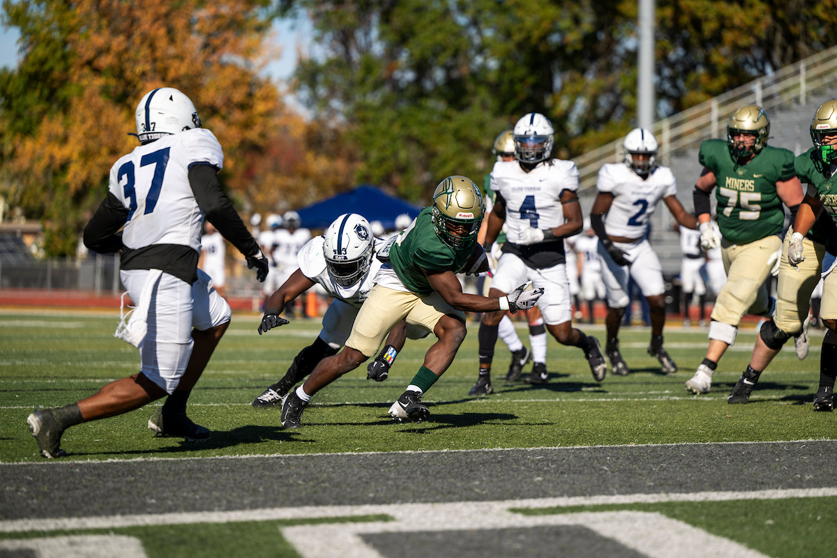 Football players on the field during Missouri S&T's Homecoming game in 2024.