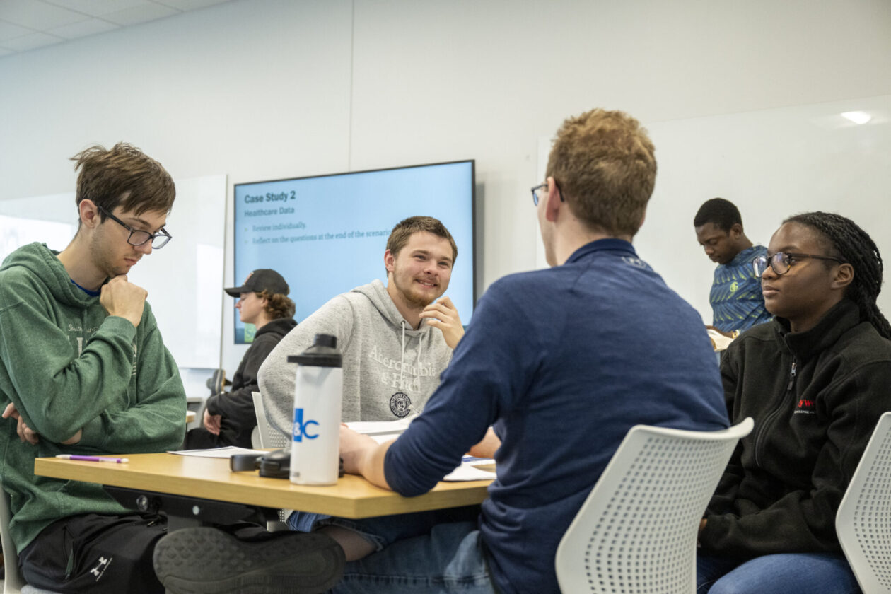 Students in a first-year engineering and computing course discuss a case study focused on a KEEN concept. Photo by Michael Pierce/Missouri S&T.