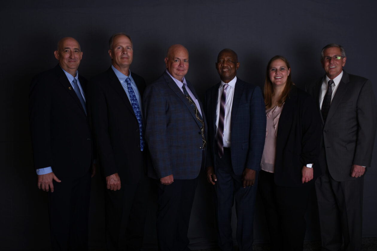 Dr. David Bayless (left), chair of mechanical and aerospace engineering at Missouri S&T, and Jon Schneider (far right), incoming president of the S&T Academy of Mechanical and Aerospace Engineers, are pictured with new academy members during the group's fall induction ceremony. New members (left to right) are Bret A. Berthold, Keith Esarey, Stanford Oliver and Leah Lenzner.