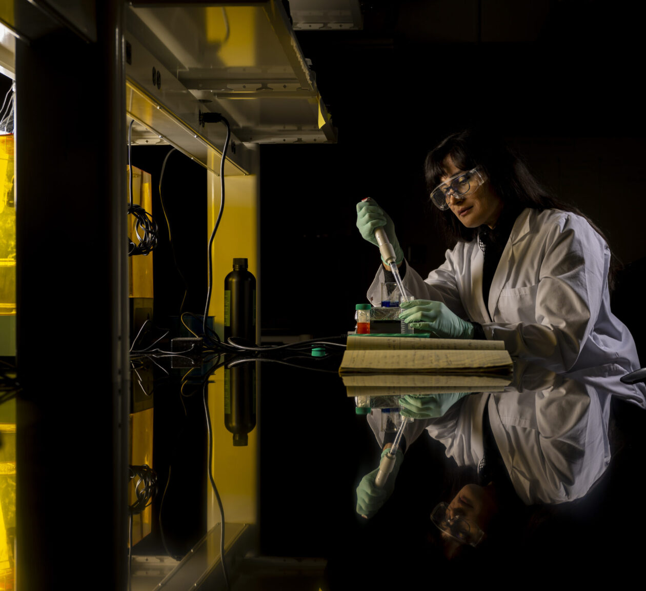 Cover photo of researcher in lab
