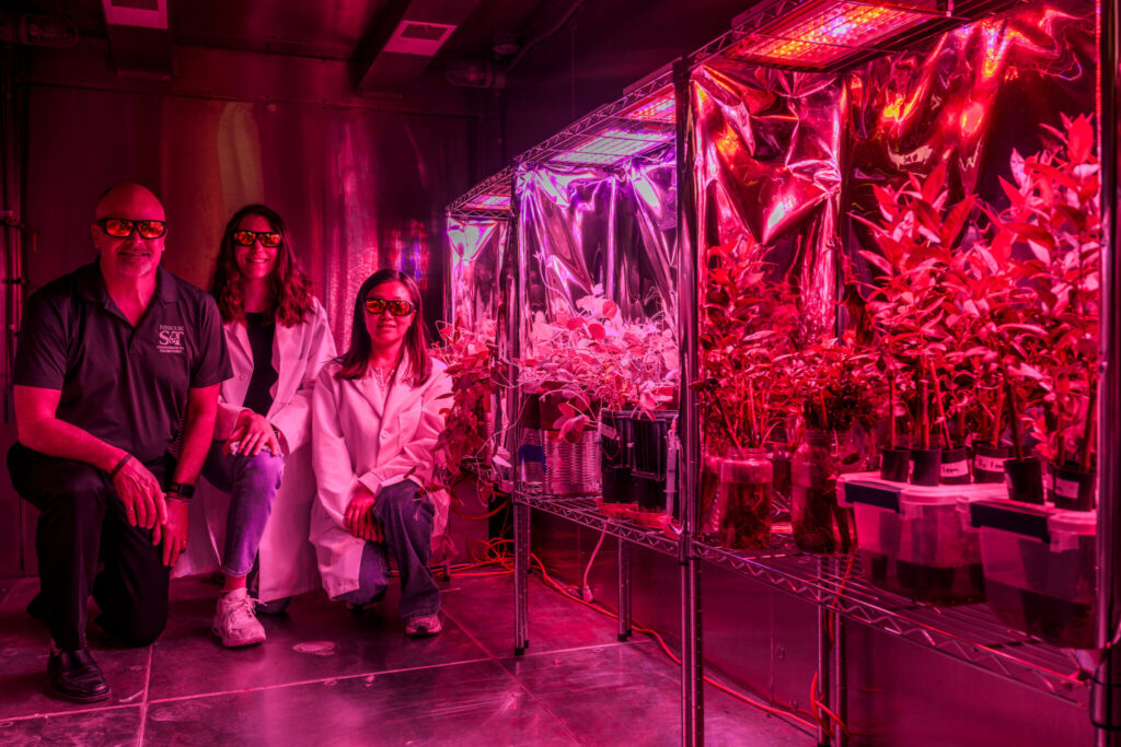 Dr. Joel Burken with students in grow chamber. 