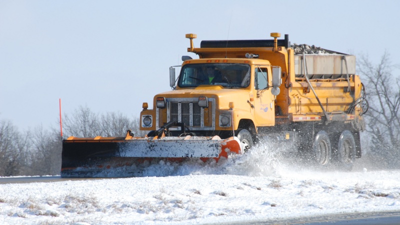 A plow removes snow and ice from a Missouri road. Photo courtesy of MoDOT